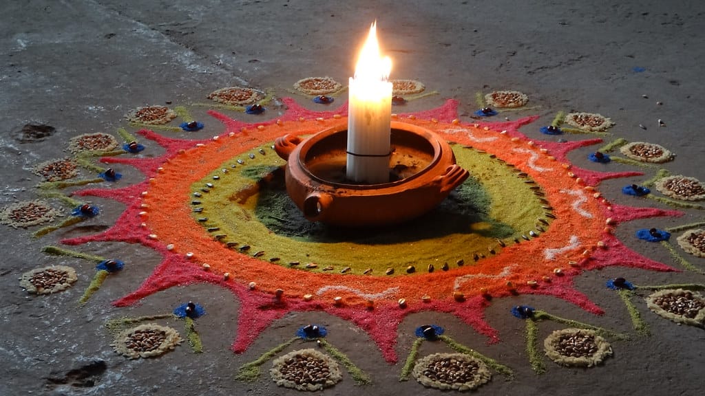 lighting candle on meditation rug end of life