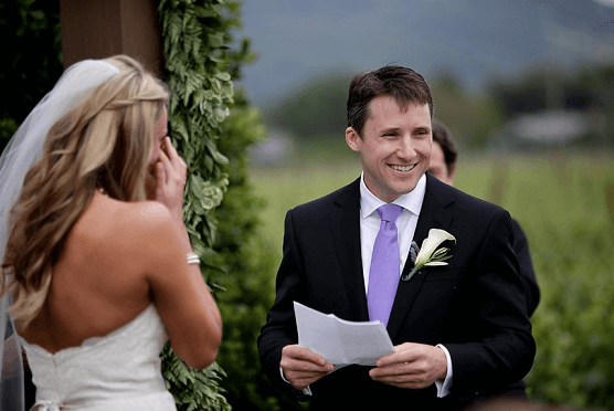 Groom reads wedding vows happy wedding