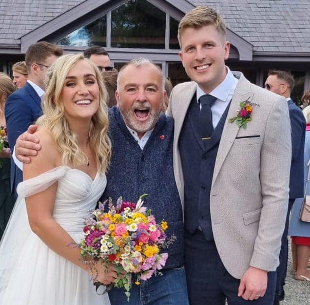 Happy Brian Twomey with Shane and Emily after wedding