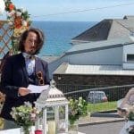 Reading at wedding ceremony Dunmore House Hotel overlooking water ideal wedding reading
